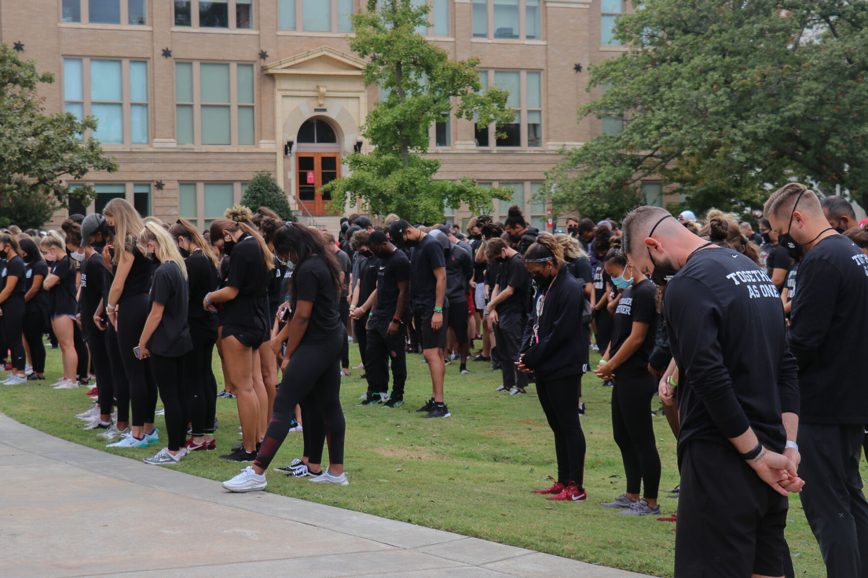 OU Athletes bow their heads for moment of silence
